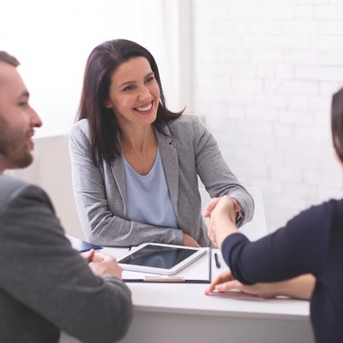 Divorced couple meets with a lawyer to modify a divorce agreement made in mediation