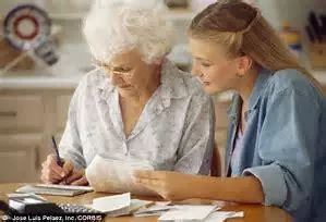 Young woman teaching old woman