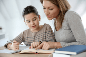 Woman reading a book with daughter