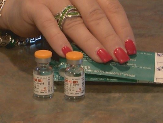 Woman holding medication