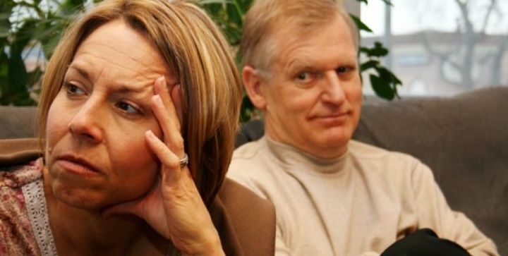 Woman with hand on her head